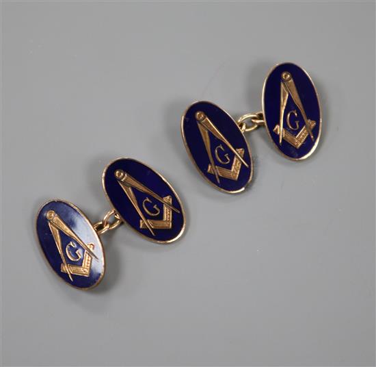 A pair of late 1950s 9ct gold and blue enamel oval masonic cufflinks, gross 9.1 grams.